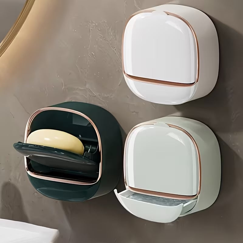 Wall-mount soap dish in dark green, white and mint showing flip-open lid